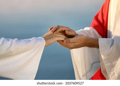 jesus christ holding womans hand 260nw 2037609527 jpg