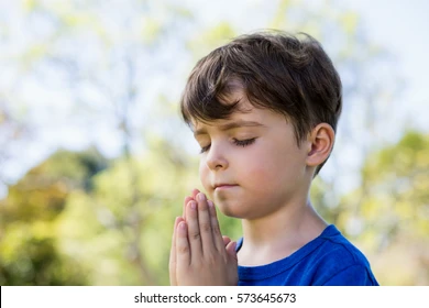 closeup boy praying eyes closed 260nw 573645673 jpg